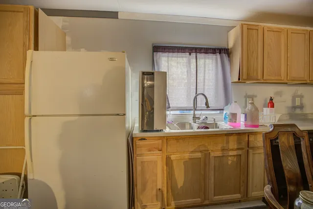 a bedroom with bunk bed and a chandelier