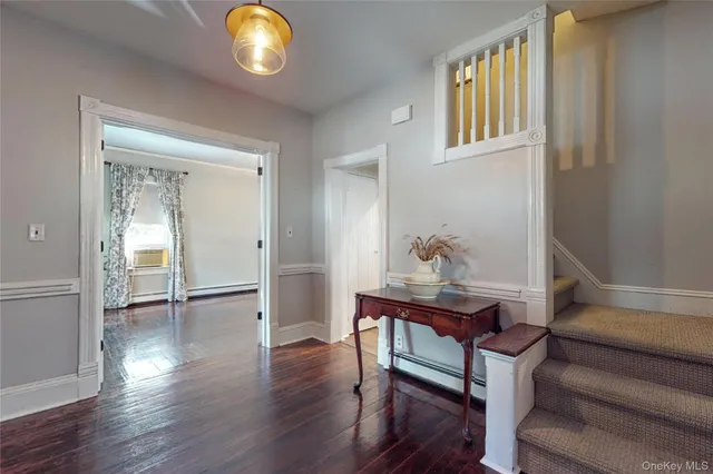 a view of a livingroom with furniture and wooden floor