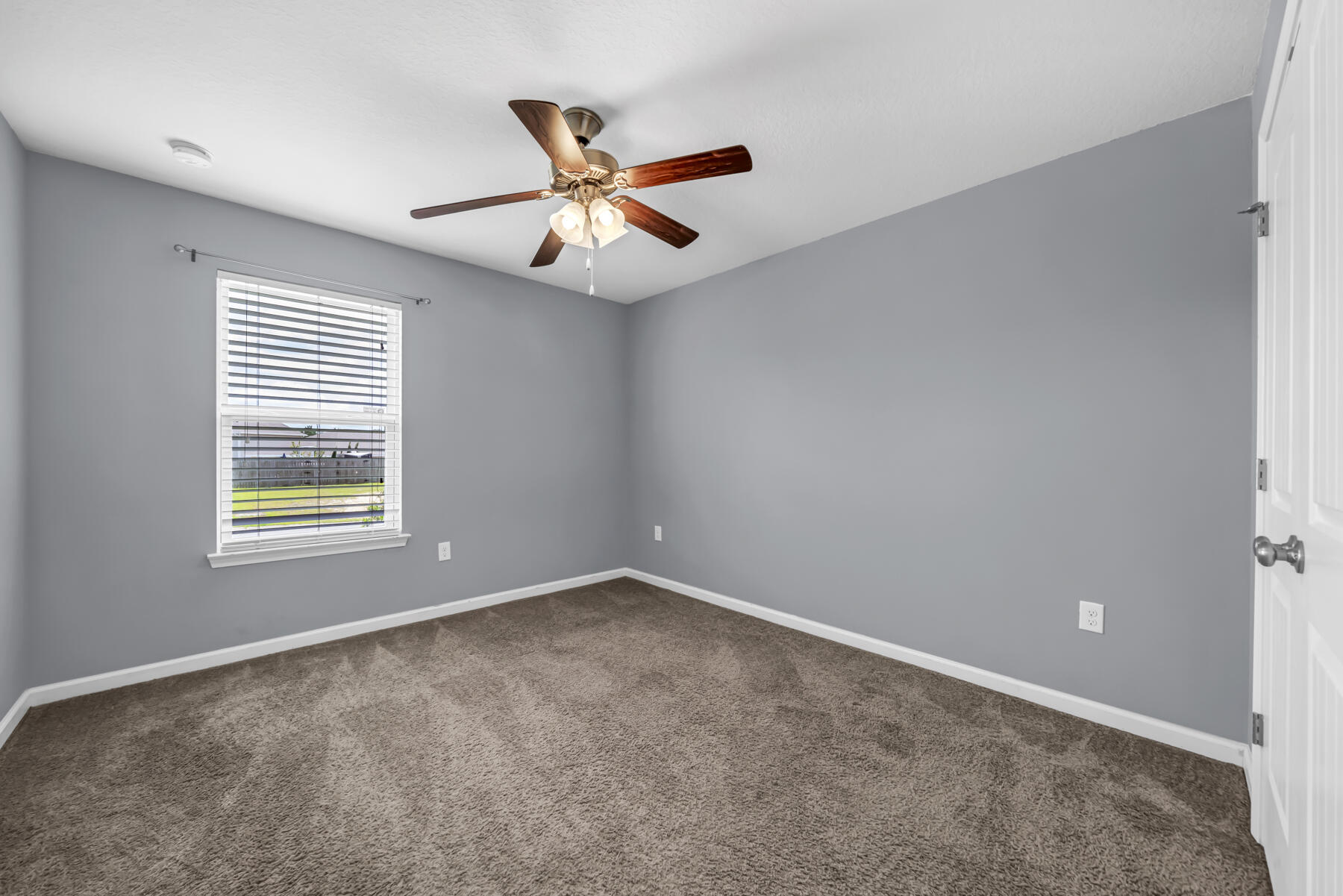 3005 Raven Lane Crestview, FL 32539 - Photo 16 of 24 a view of an empty room with a window