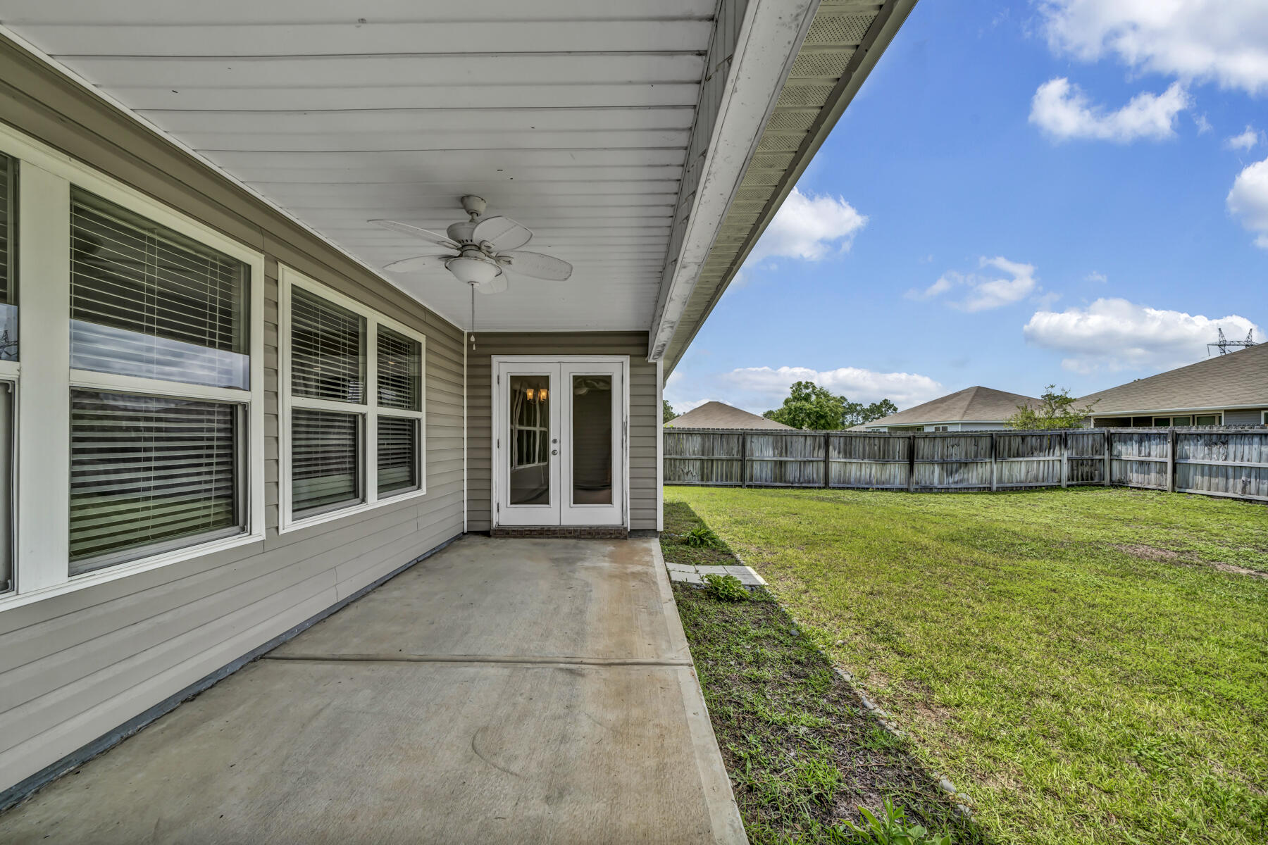 3005 Raven Lane Crestview, FL 32539 - Photo 21 of 24 a view of a house with backyard and garden