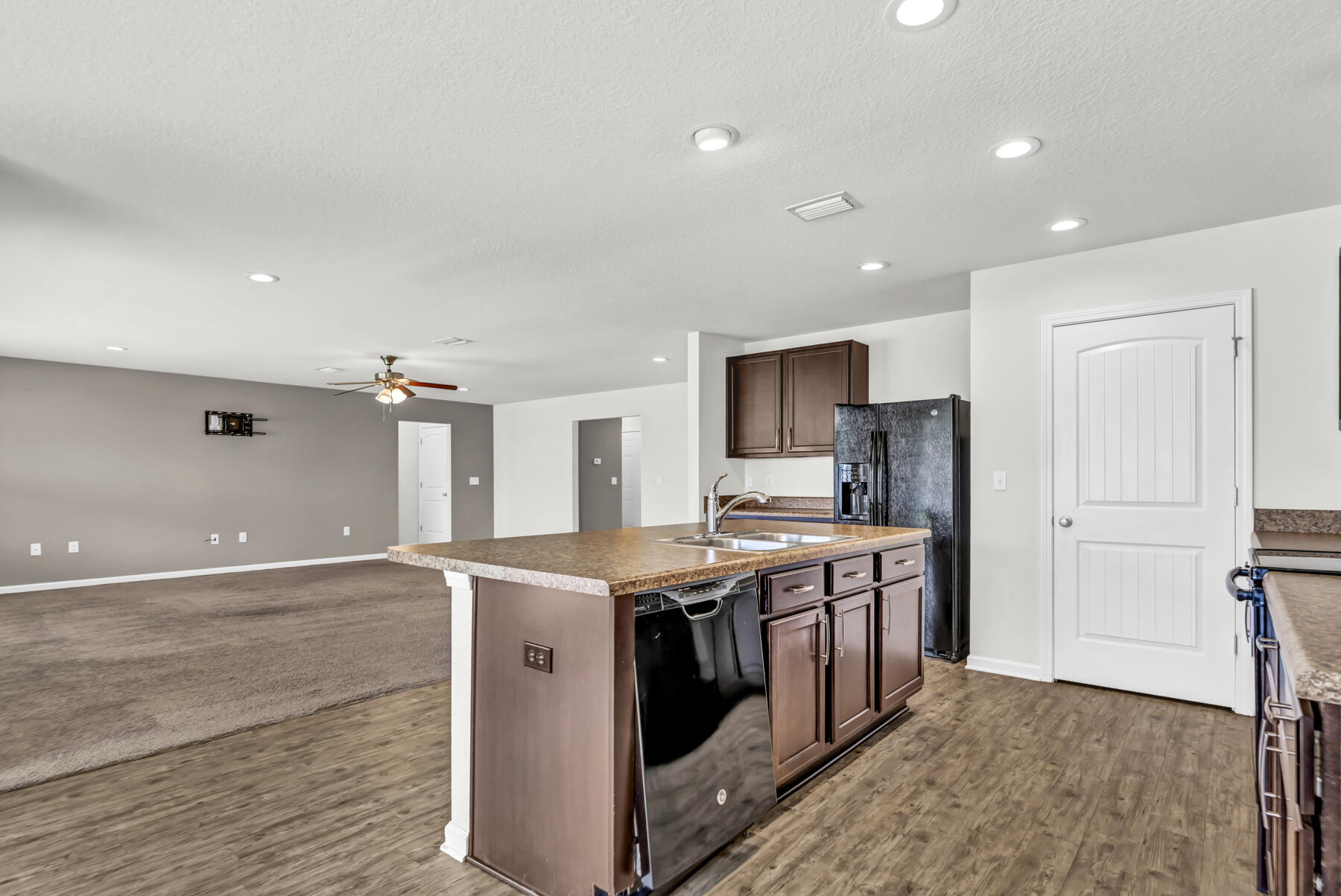 3005 Raven Lane Crestview, FL 32539 - Photo 5 of 24 a kitchen with stainless steel appliances granite countertop a stove and a sink