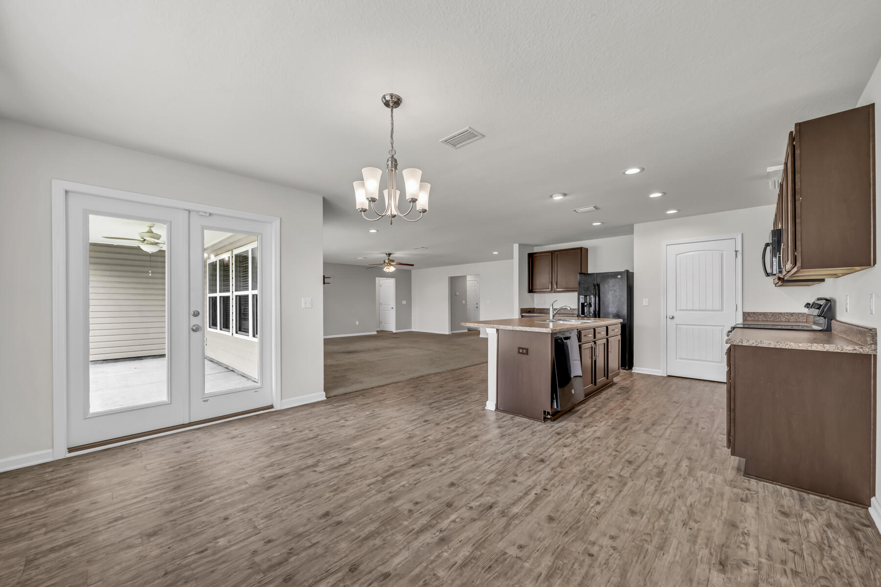 3005 Raven Lane Crestview, FL 32539 - Photo 6 of 24 a view of kitchen with refrigerator stove and microwave