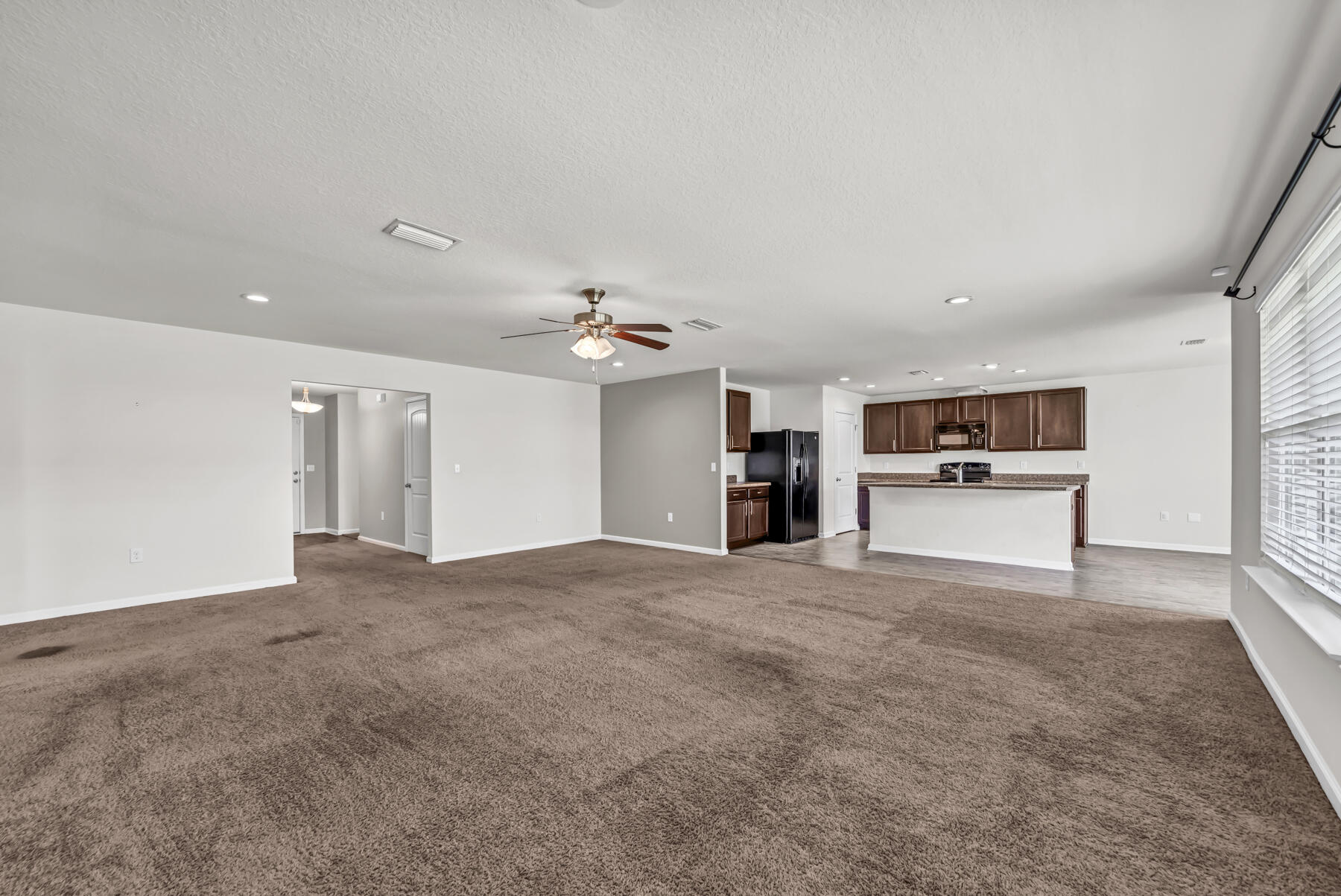3005 Raven Lane Crestview, FL 32539 - Photo 9 of 24 a view of a kitchen with a sink and a stove top oven