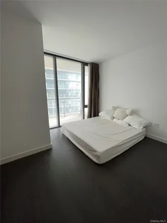 a room with pool table and a window