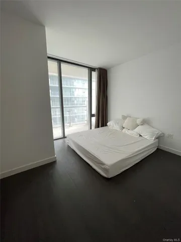 a room with pool table and a window