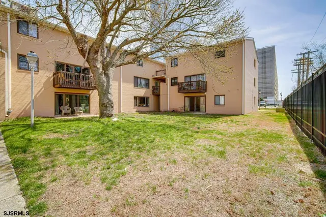a view of a building with a big yard