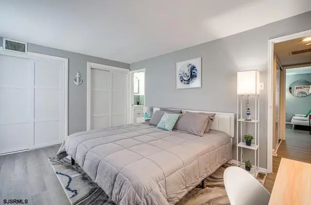 a bedroom with a bed and a couch