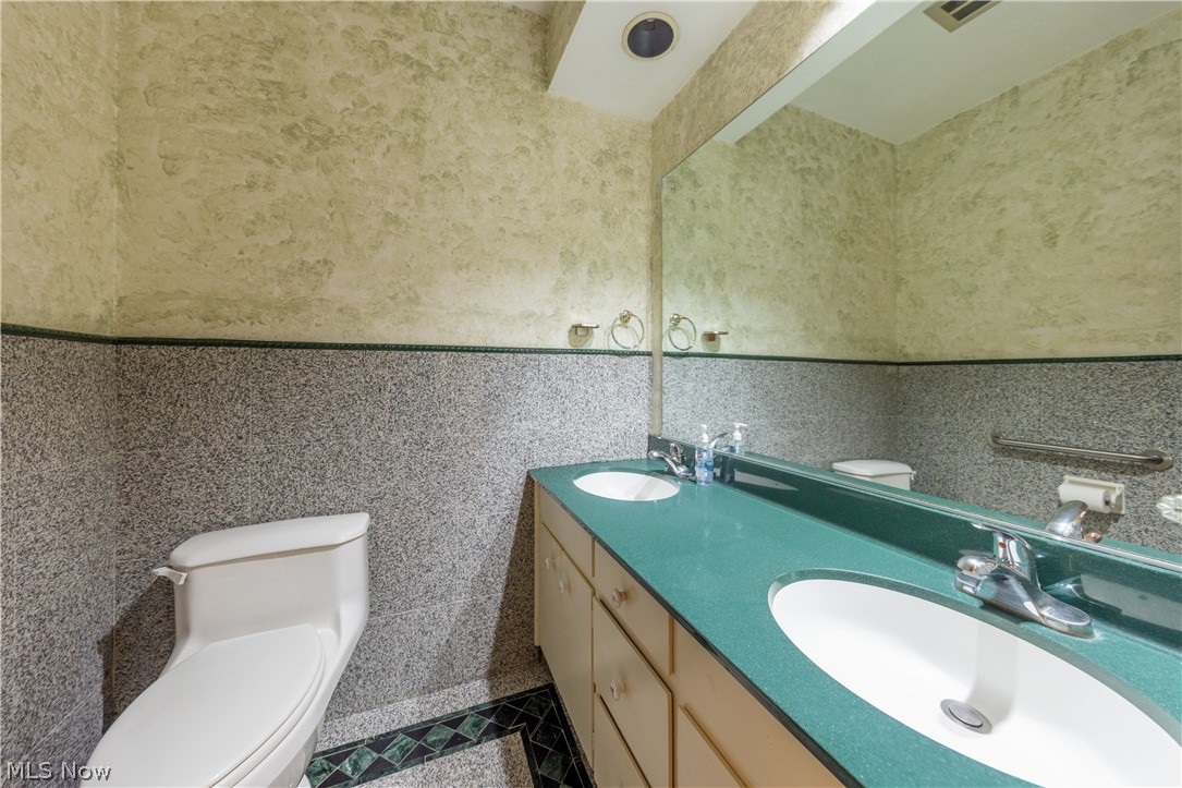 25001 Letchworth Road Beachwood, OH 44122 - Photo 23 of 50 Double vanity with integrated sinks and chrome fixtures