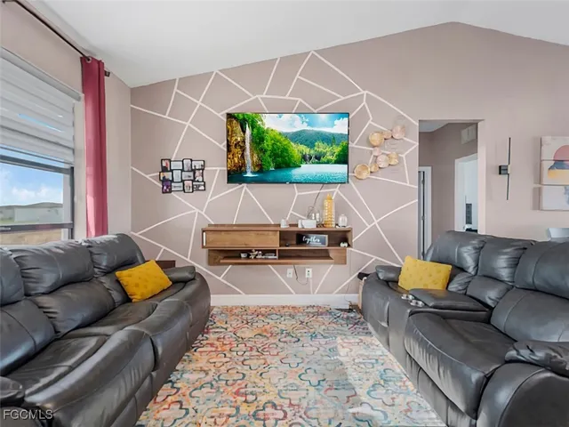 a living room with furniture and a couch
