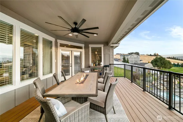 a view of a patio with a table chairs and a balcony