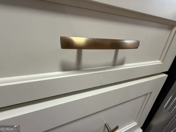 a view of a house with backyard and trees