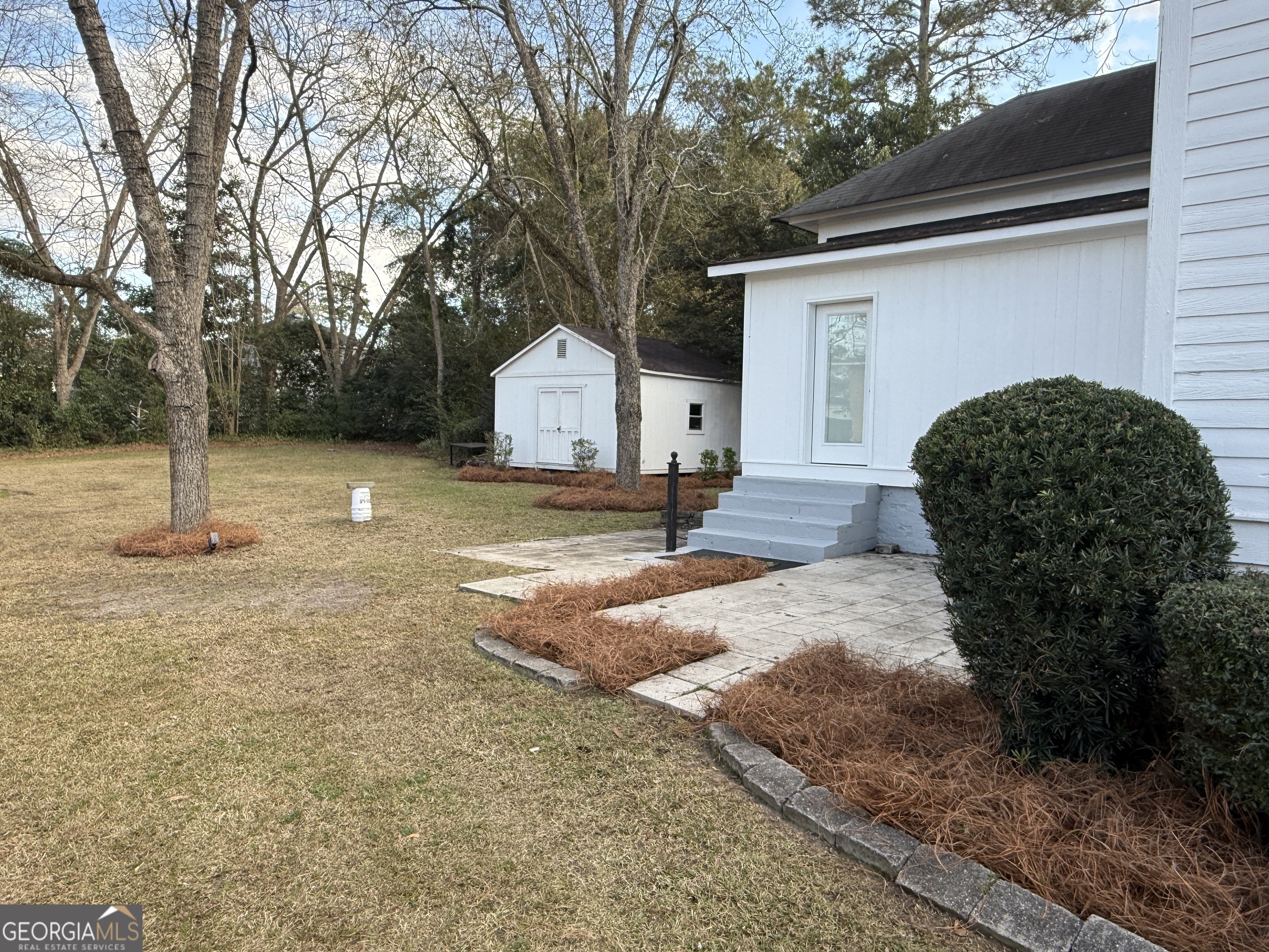 646 McLendon Street Ashburn, GA 31714 - Photo 24 of 63 a view of a house with backyard and trees