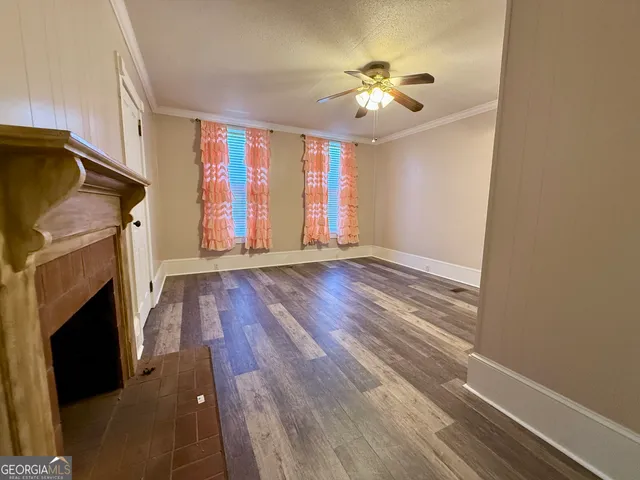 a room with wooden floor and a table