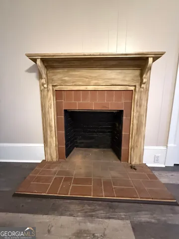 a living room with a mirror and a furniture