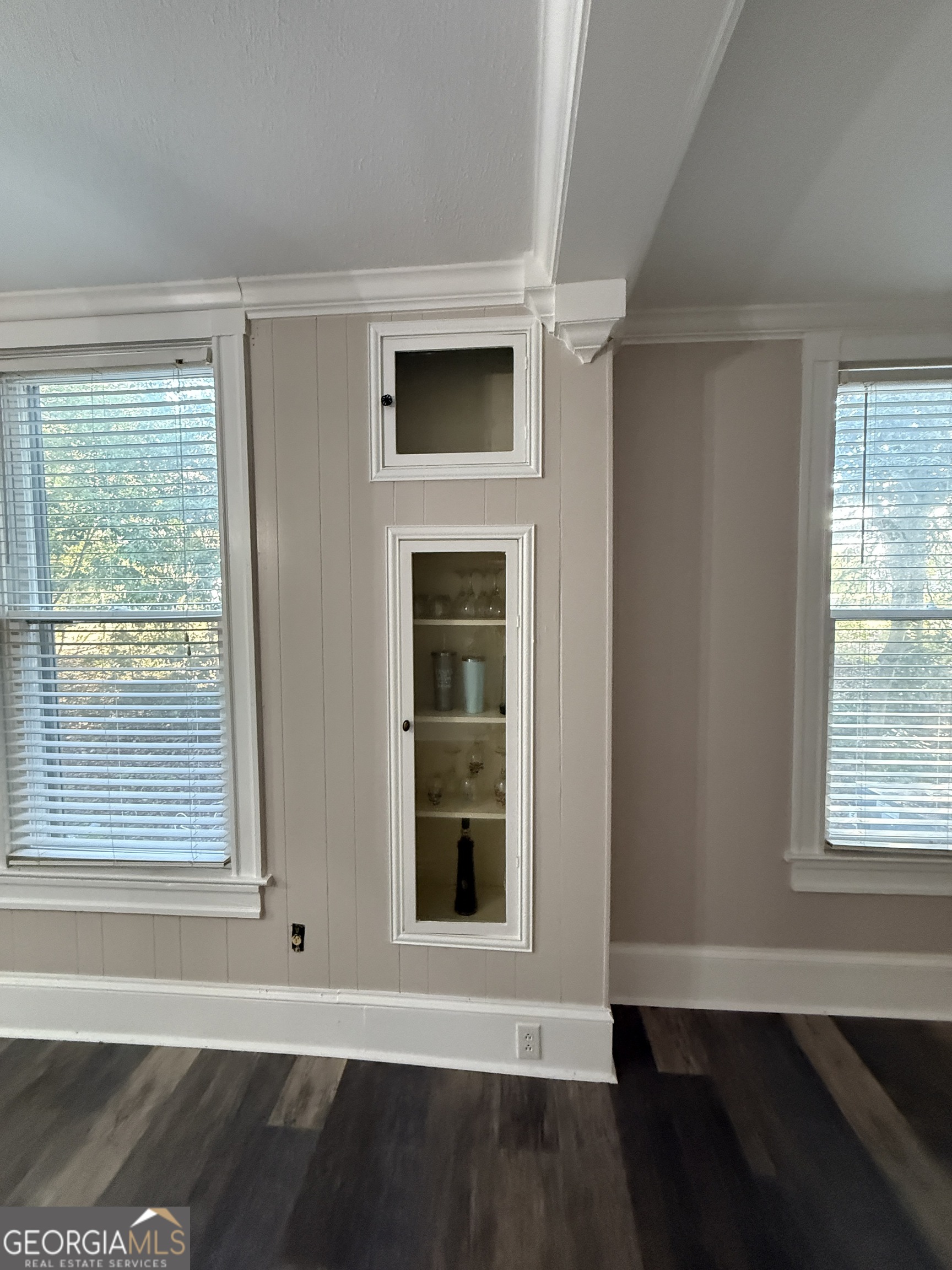 646 McLendon Street Ashburn, GA 31714 - Photo 42 of 63 a view of an empty room with wooden floor and a window