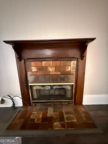 a backyard of a house with lots of plants and trees