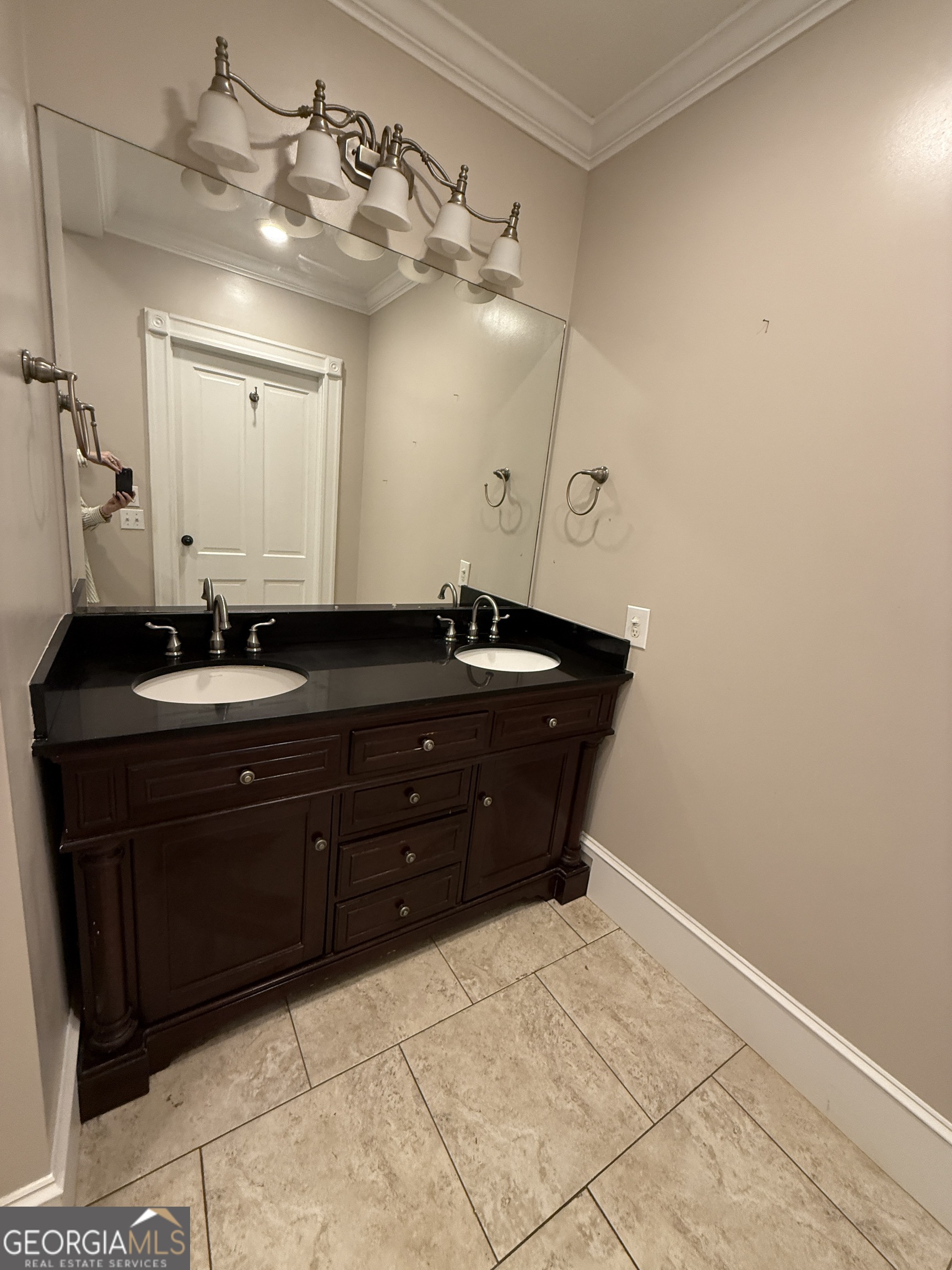 646 McLendon Street Ashburn, GA 31714 - Photo 48 of 63 a bathroom with a sink and a mirror