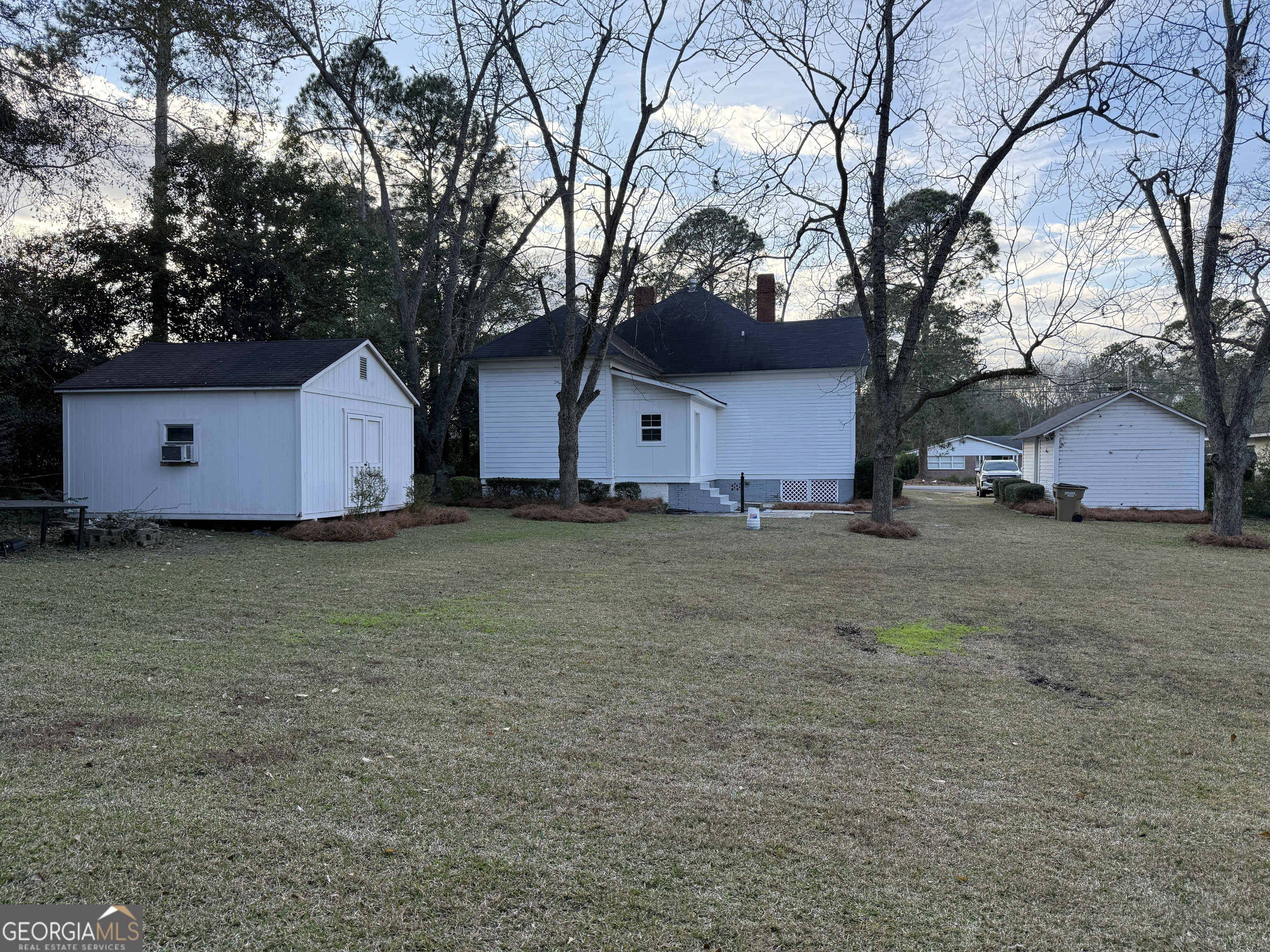 646 McLendon Street Ashburn, GA 31714 - Photo 5 of 63 a house that has a tree in front of it