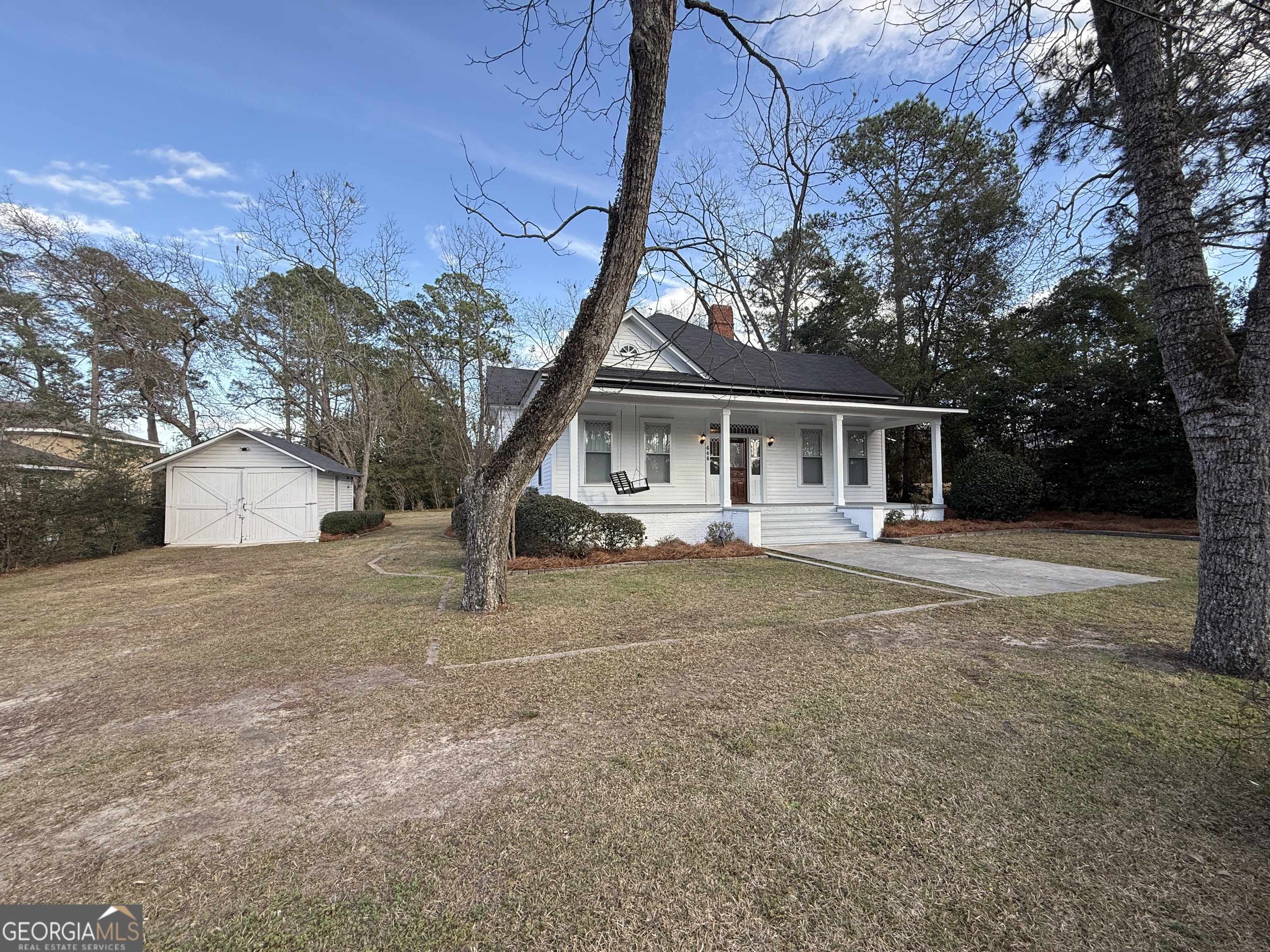 646 McLendon Street Ashburn, GA 31714 - Photo 57 of 63 a house with trees in front of it
