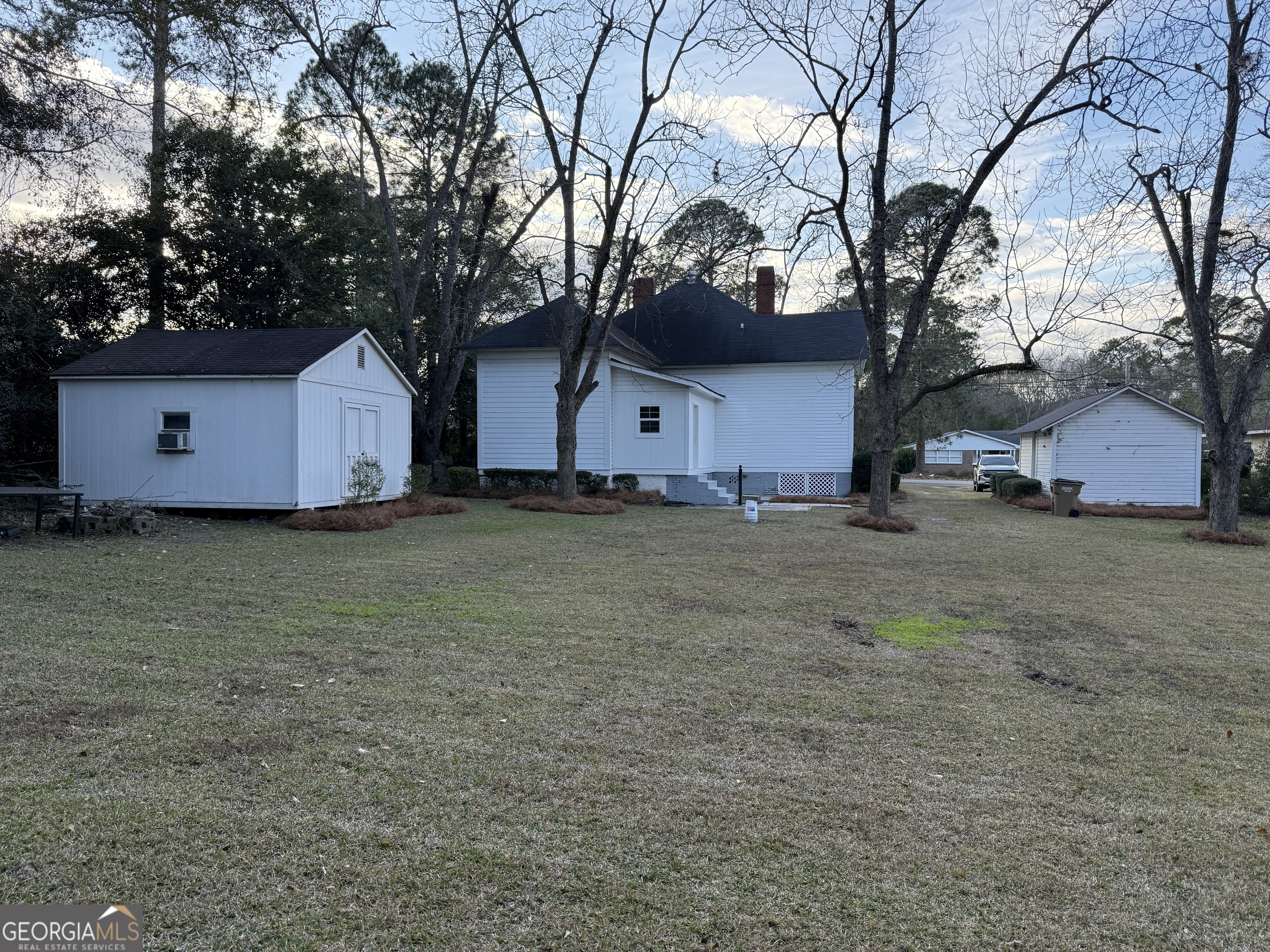 646 McLendon Street Ashburn, GA 31714 - Photo 6 of 63 a house that has a tree in front of it