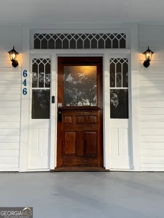 a living room with a walk in closet and a large window