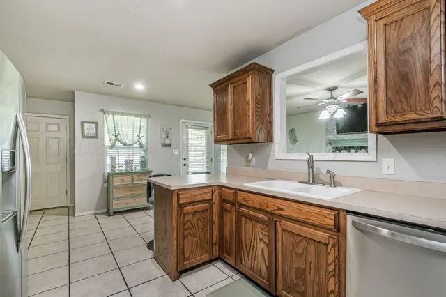 a kitchen with a sink and cabinets