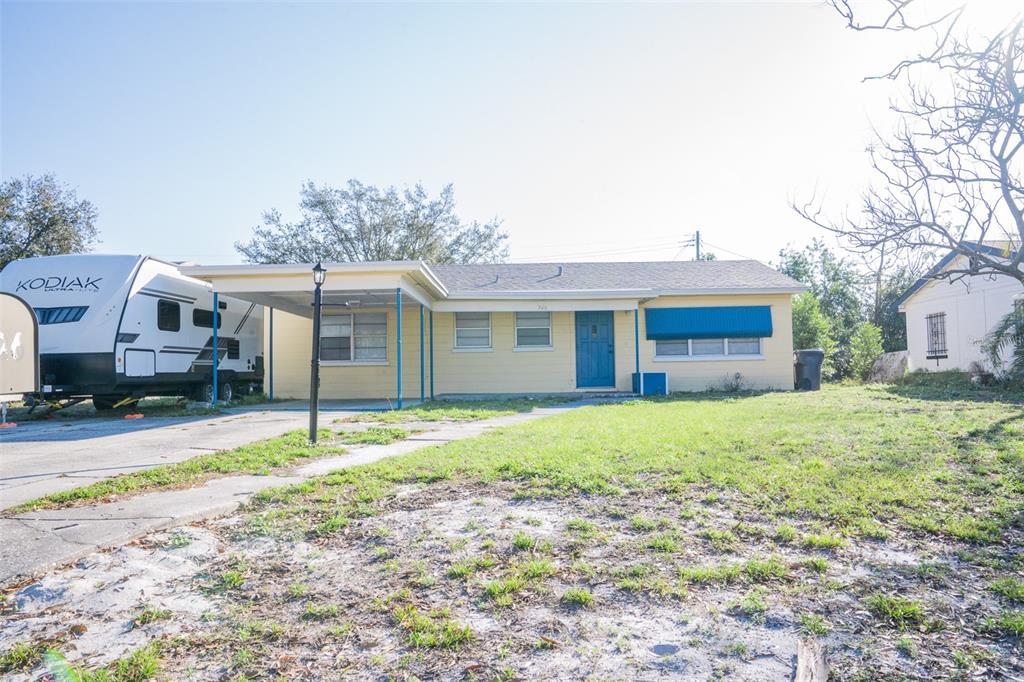 526 Hampton Avenue Lakeland, FL 33801 - Photo 1 of 15 a front view of a house with a yard and garage