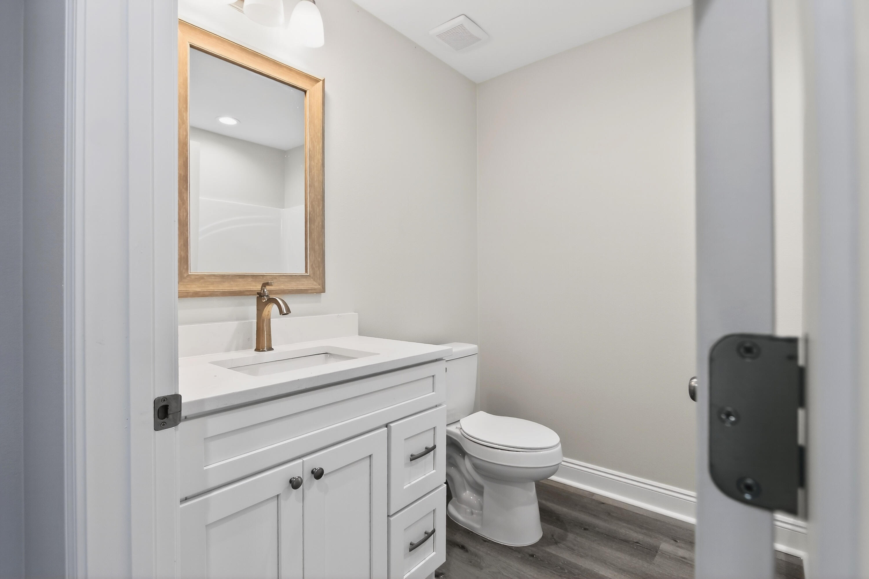 5358 Highview Drive Crestview, FL 32539 - Photo 13 of 31 a bathroom with a toilet sink and vanity