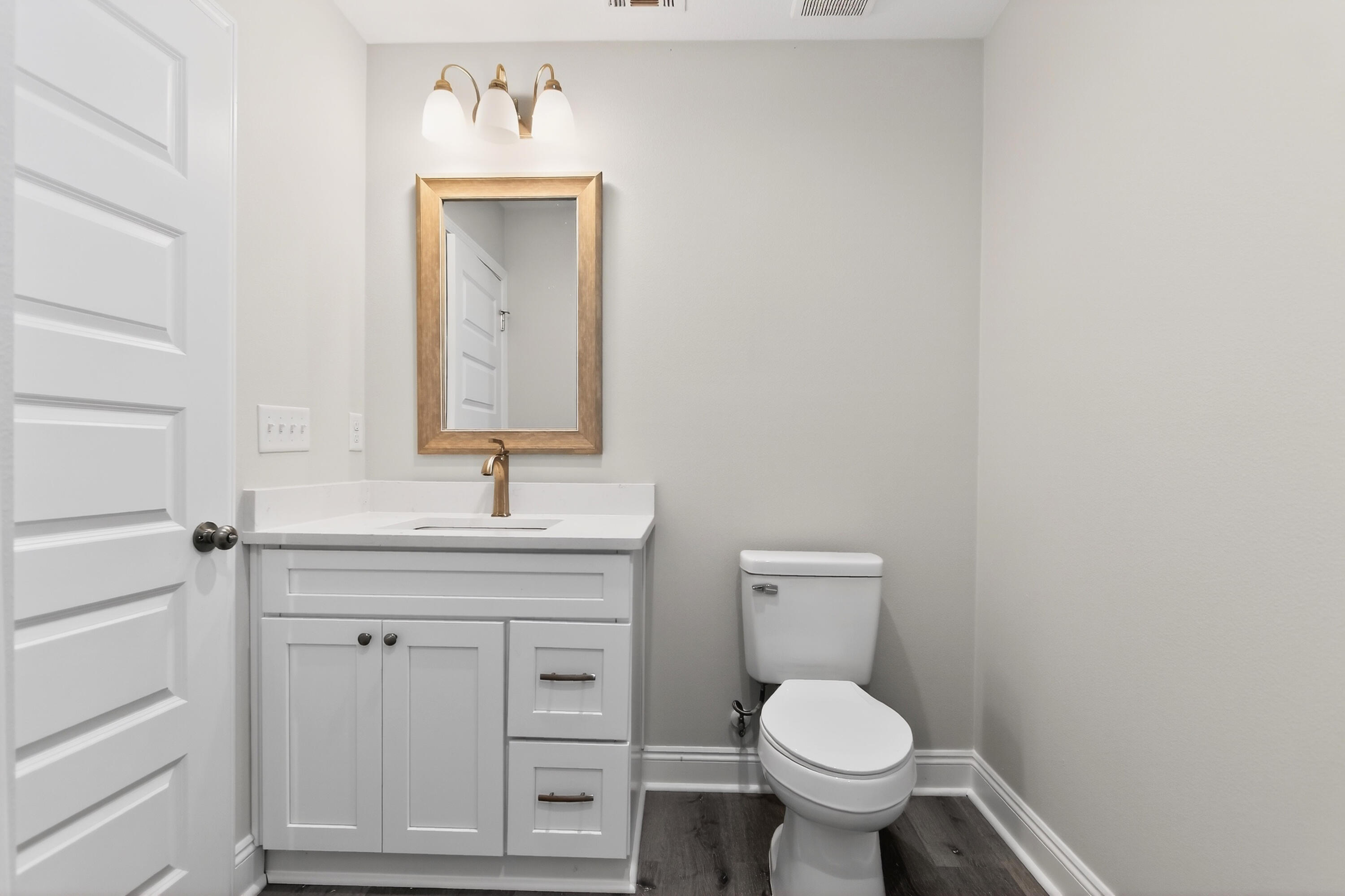 5358 Highview Drive Crestview, FL 32539 - Photo 14 of 31 a bathroom with a toilet sink and mirror