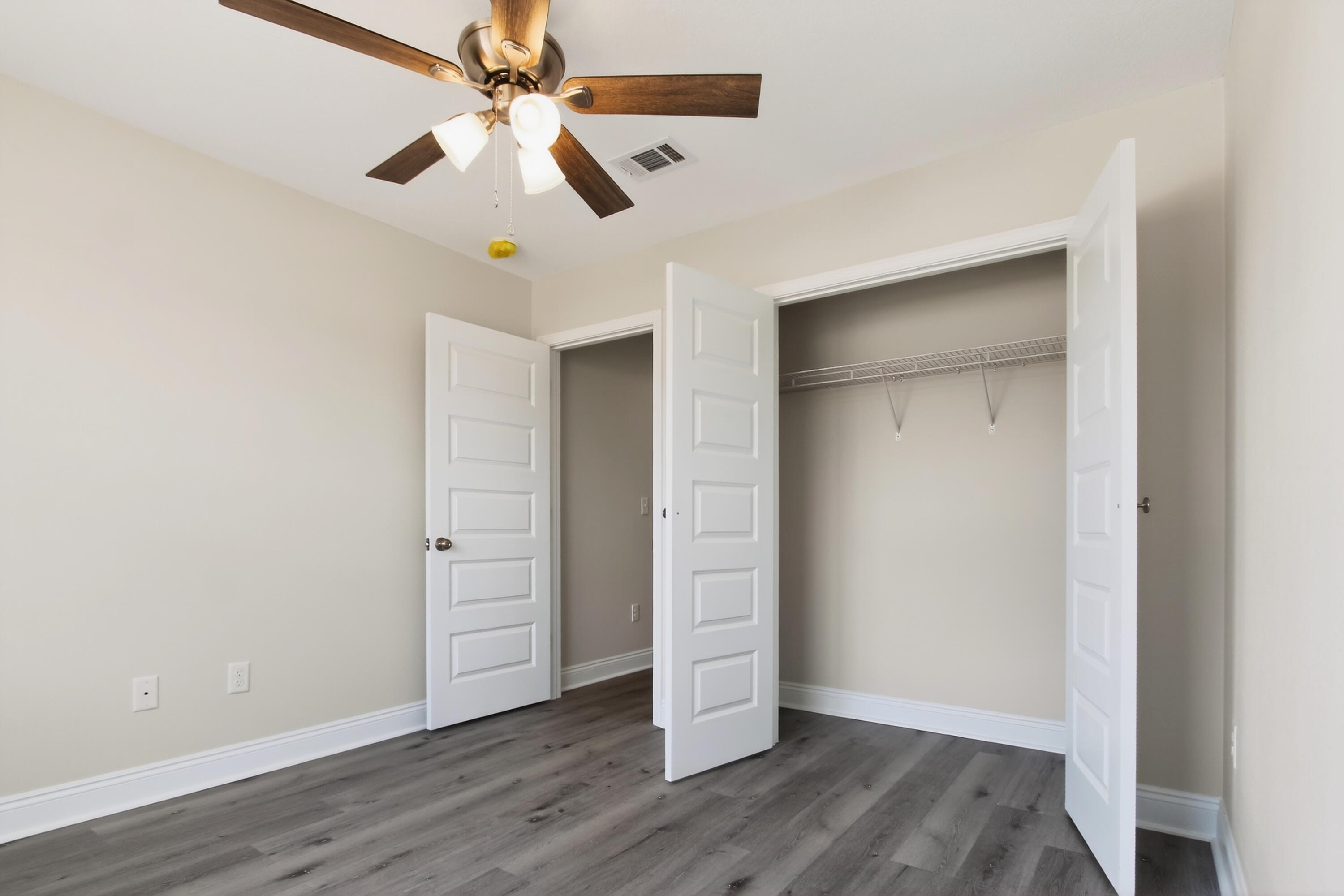 5358 Highview Drive Crestview, FL 32539 - Photo 16 of 31 wooden floor in an empty room
