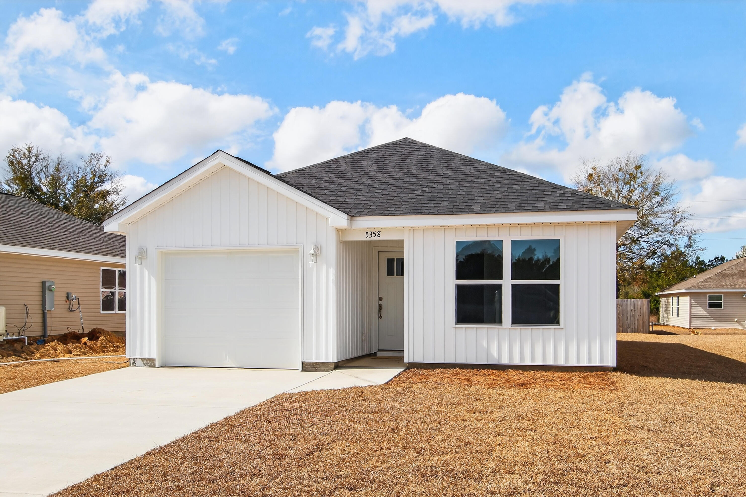5358 Highview Drive Crestview, FL 32539 - Photo 3 of 31 a house with trees in the background