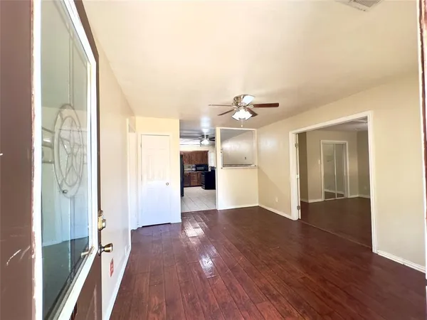 a view of a livingroom with wooden floor