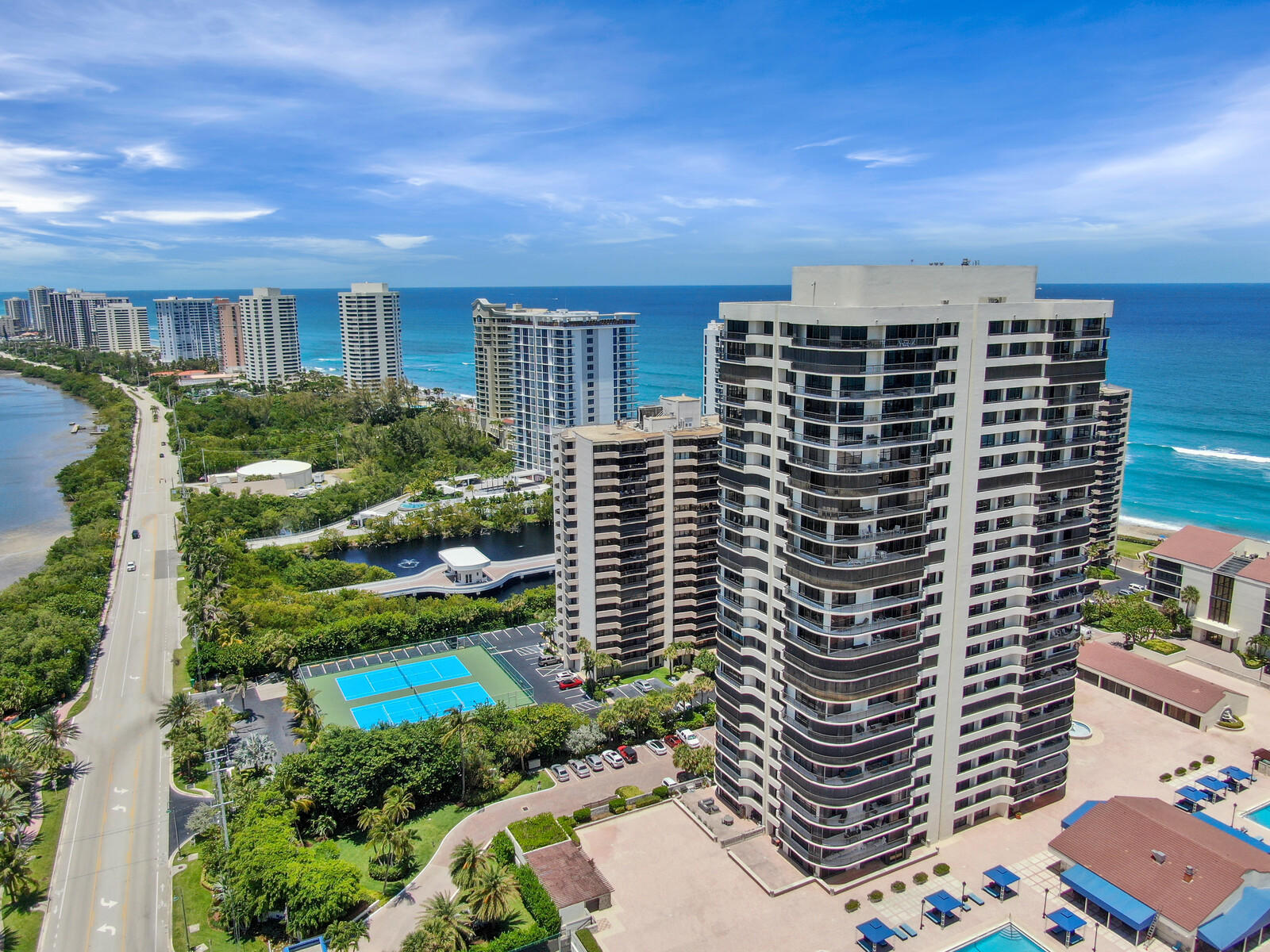 4100 North Ocean Drive, Unit 503 Singer Island, FL 33404 - Photo 1 of 51 a front view of a building with garden space and street view