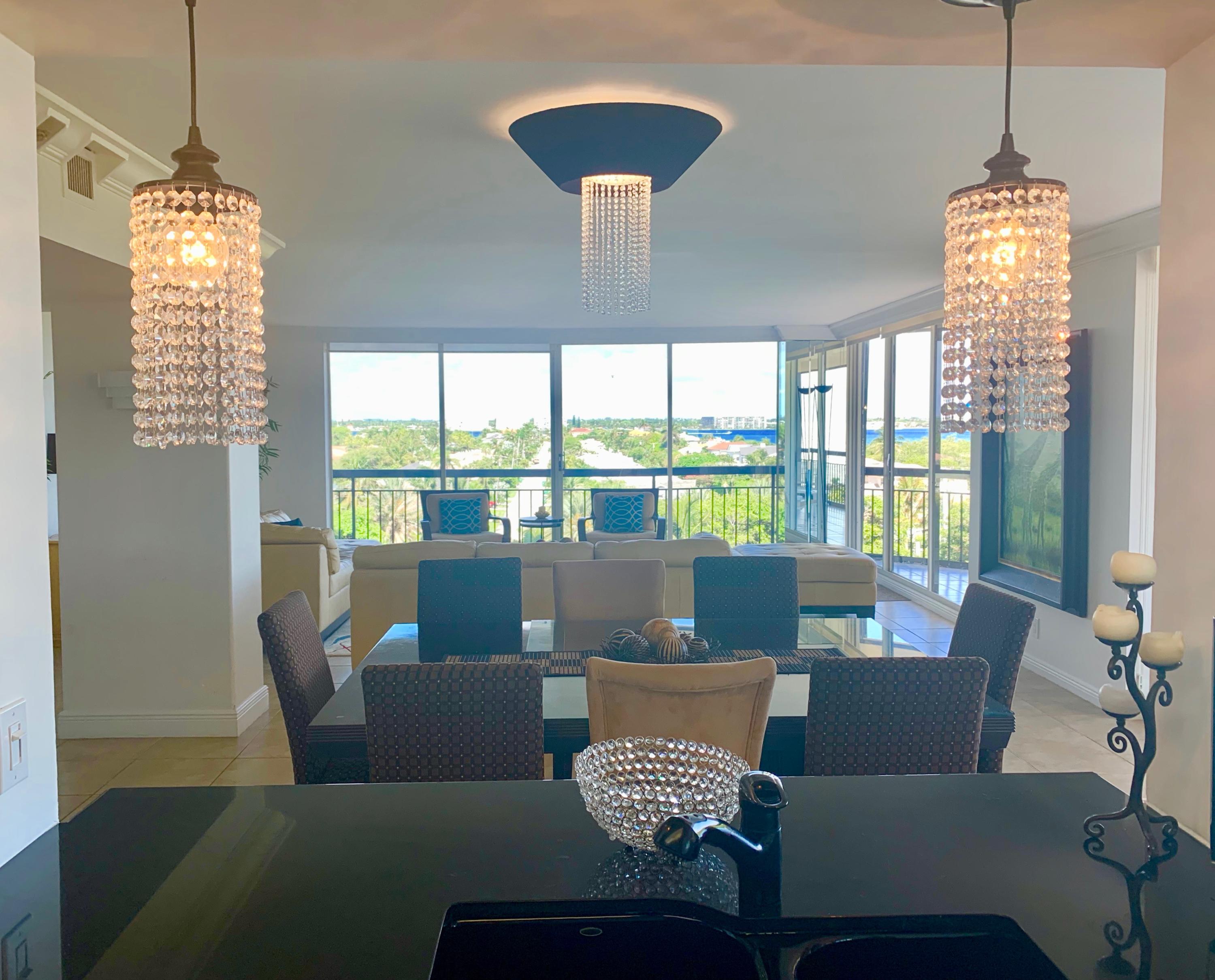 4100 North Ocean Drive, Unit 503 Singer Island, FL 33404 - Photo 16 of 51 a living room with furniture and a chandelier