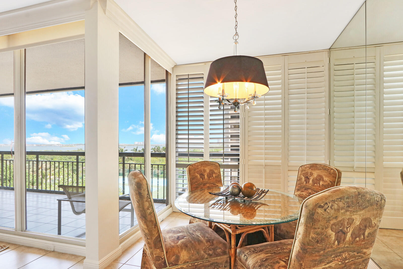 4100 North Ocean Drive, Unit 503 Singer Island, FL 33404 - Photo 17 of 51 a lamp room with furniture and wooden floor