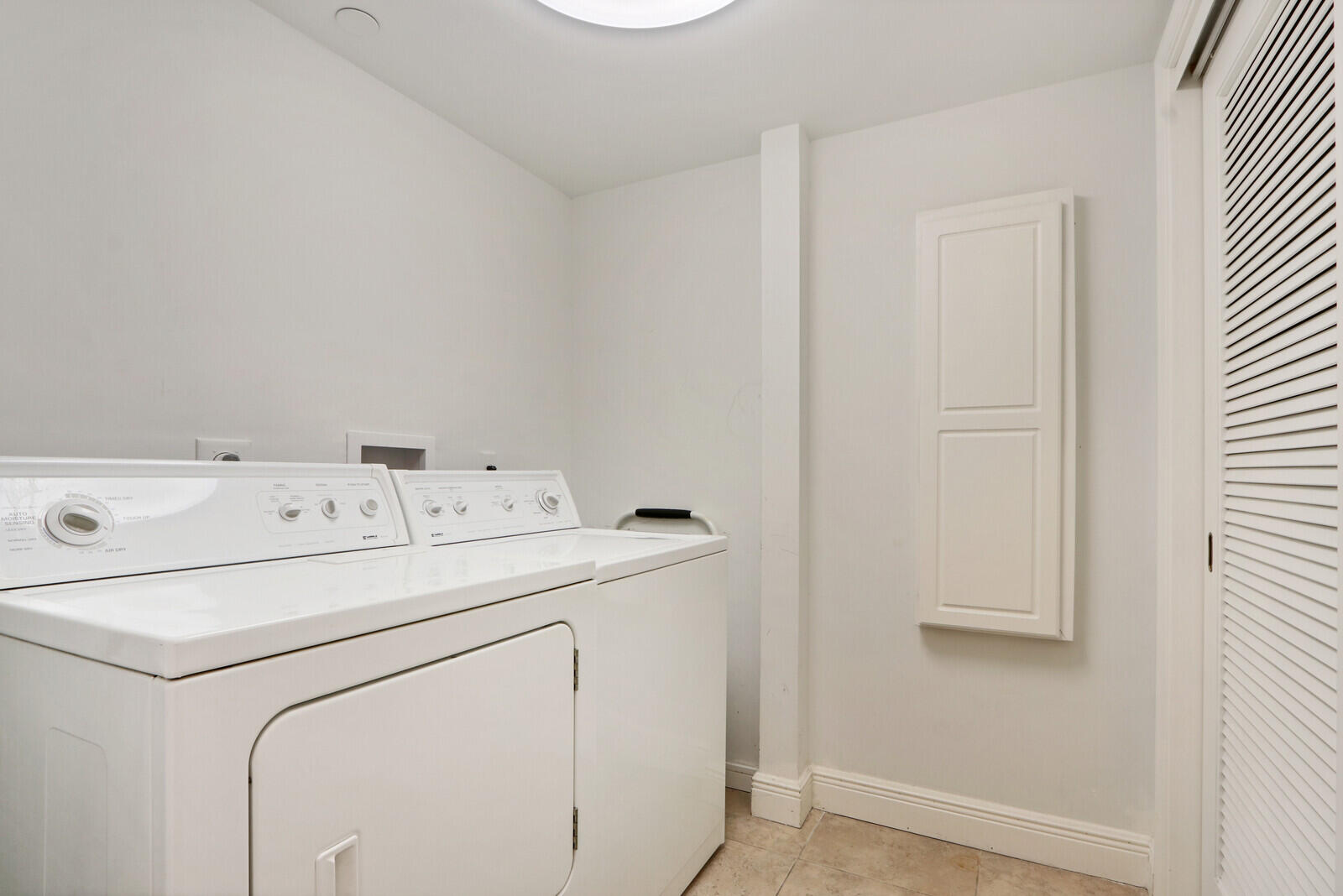 4100 North Ocean Drive, Unit 503 Singer Island, FL 33404 - Photo 22 of 51 a utility room with dryer and washer