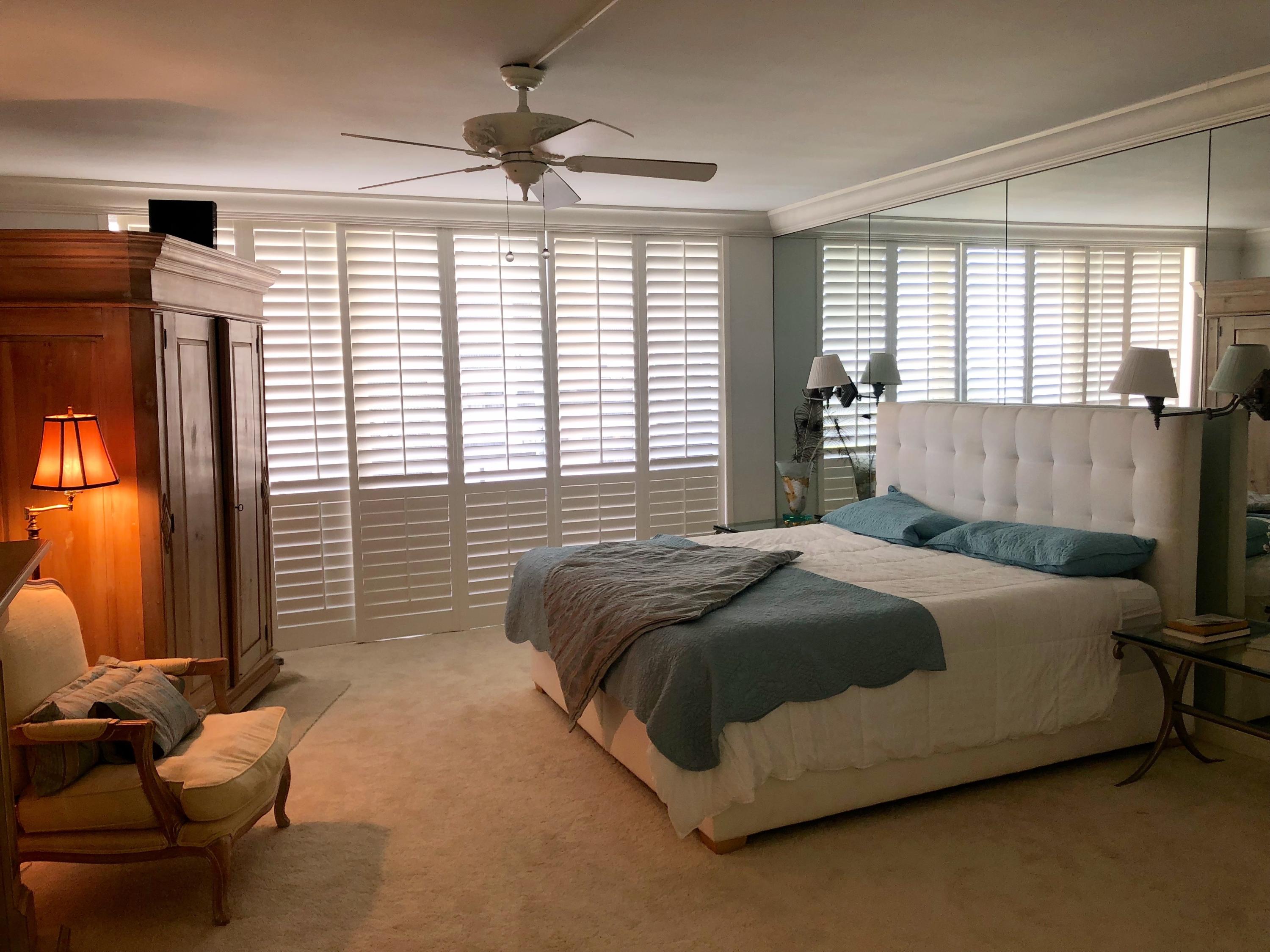 4100 North Ocean Drive, Unit 503 Singer Island, FL 33404 - Photo 23 of 51 a bedroom with a bed and wooden floor