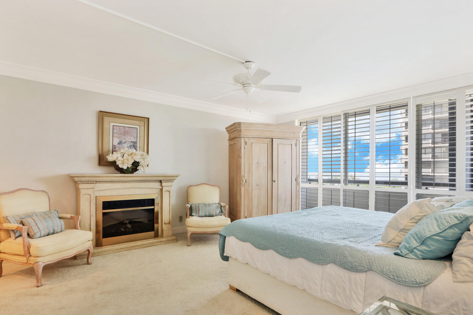 4100 North Ocean Drive, Unit 503 Singer Island, FL 33404 - Photo 25 of 51 a bedroom with a bed and a fireplace