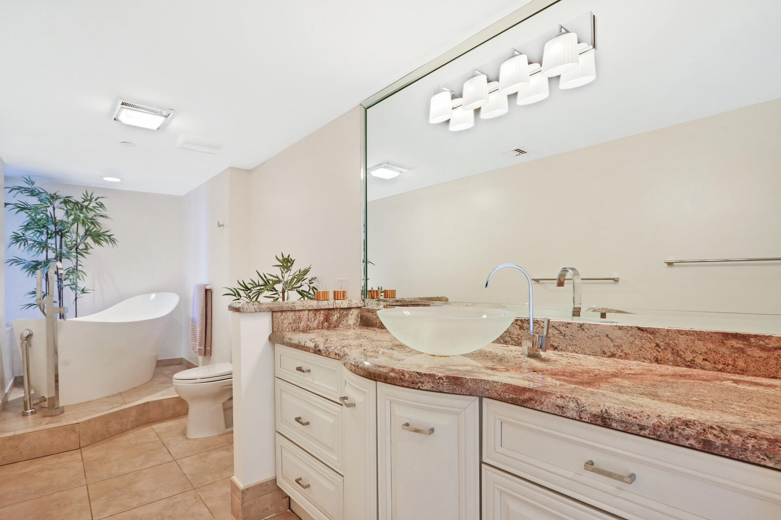 4100 North Ocean Drive, Unit 503 Singer Island, FL 33404 - Photo 26 of 51 a bathroom with a granite countertop sink mirror and toilet