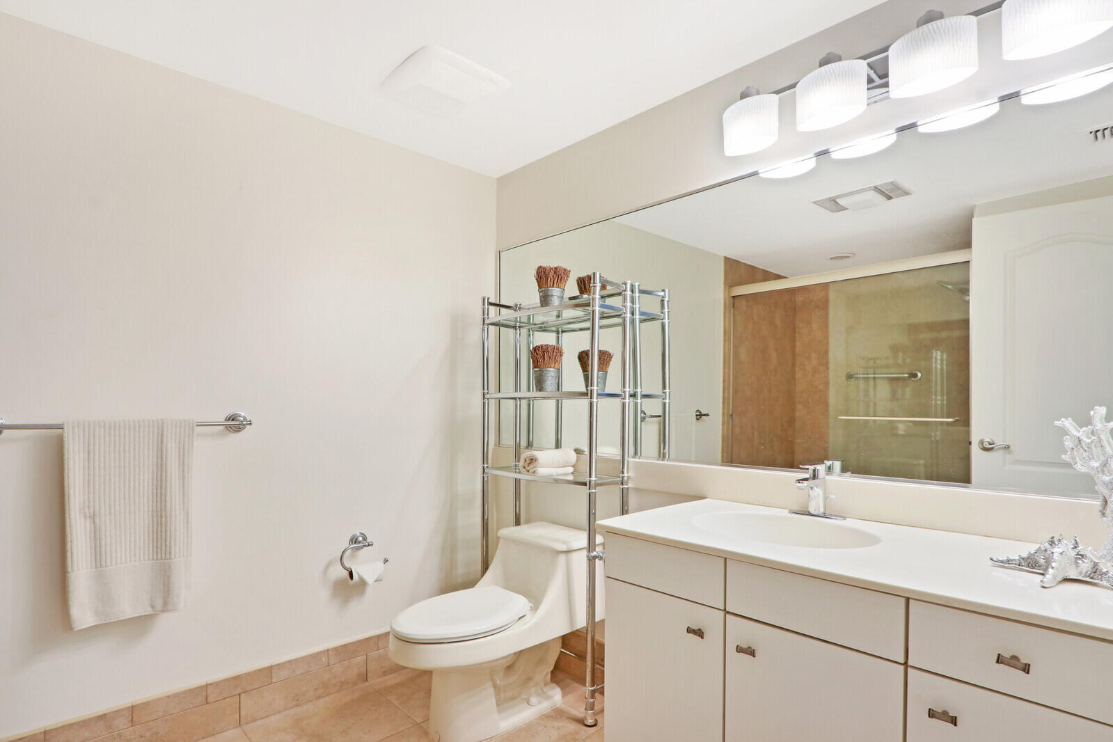 4100 North Ocean Drive, Unit 503 Singer Island, FL 33404 - Photo 28 of 51 a bathroom with a double vanity sink mirror and toilet