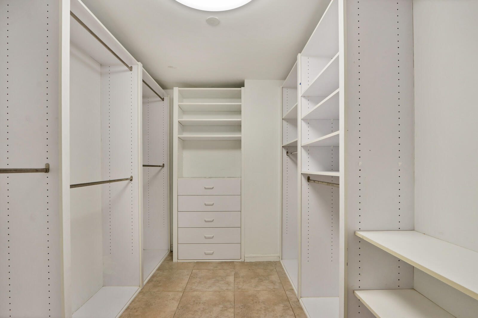 4100 North Ocean Drive, Unit 503 Singer Island, FL 33404 - Photo 30 of 51 a view of walk in closet with empty racks