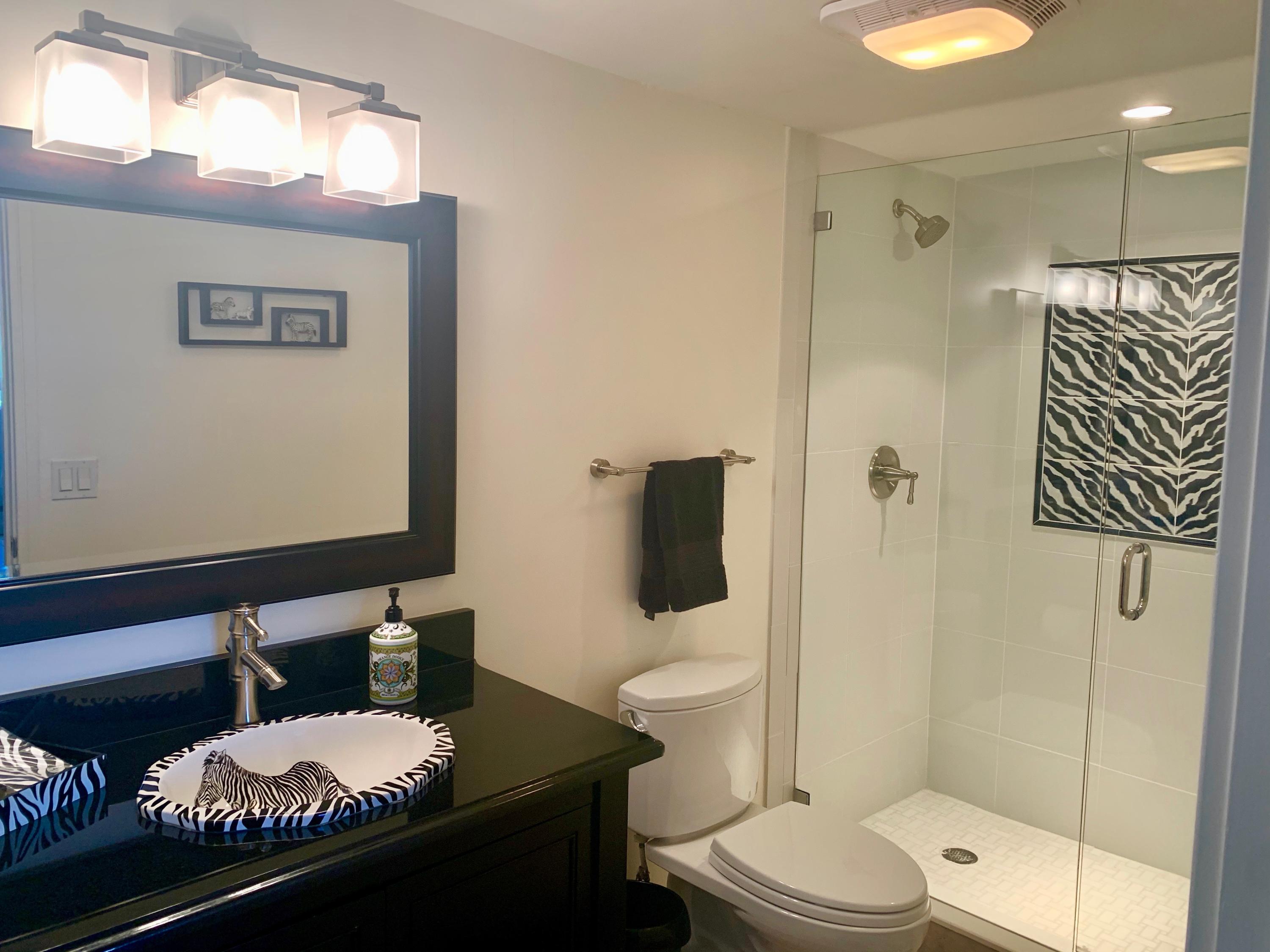 4100 North Ocean Drive, Unit 503 Singer Island, FL 33404 - Photo 38 of 51 a bathroom with a toilet a sink and shower