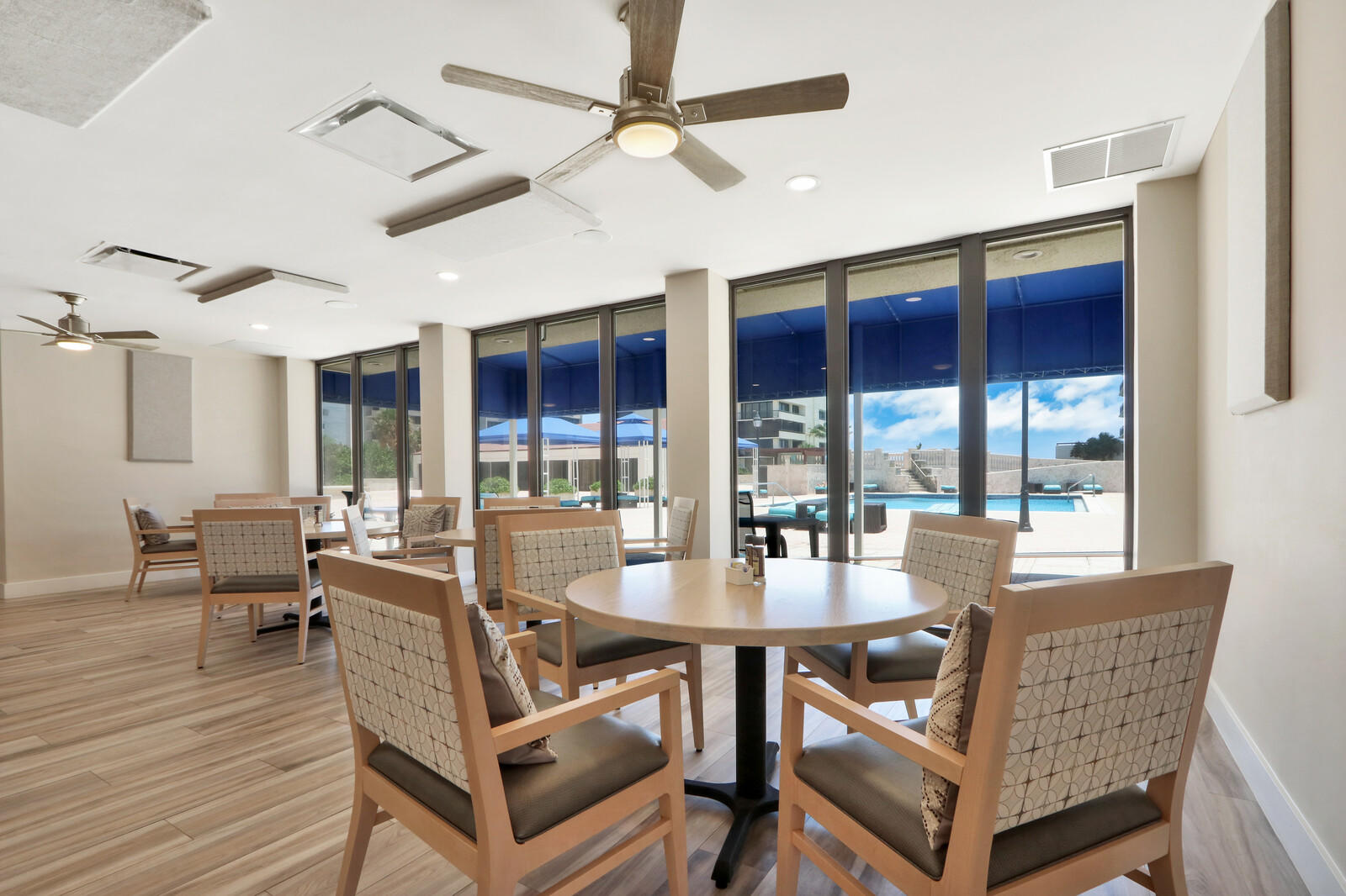 4100 North Ocean Drive, Unit 503 Singer Island, FL 33404 - Photo 41 of 51 a dining room with furniture a chandelier and wooden floor