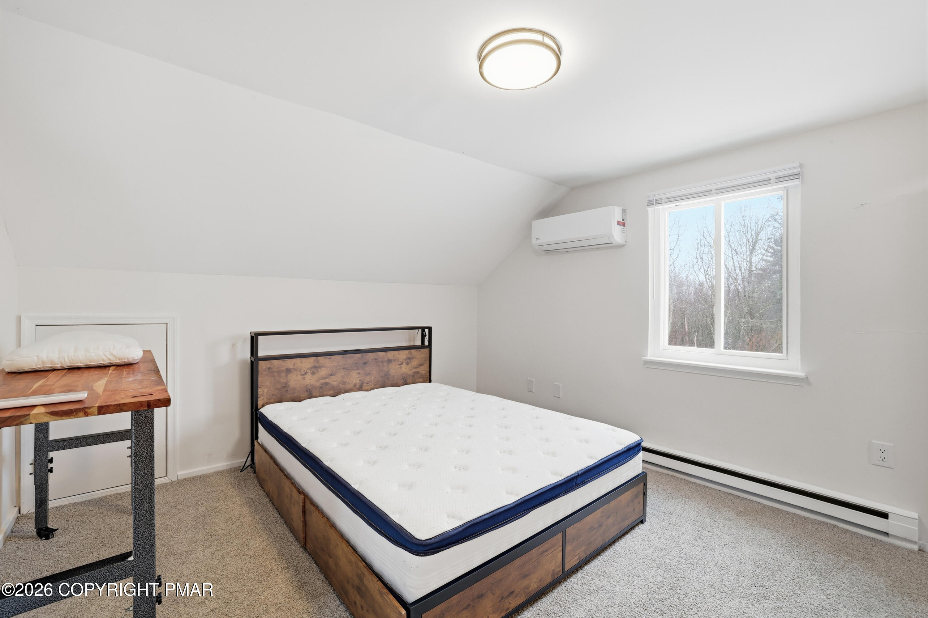 319 Ramble Bush Road Stroudsburg, PA 18360 - Photo 12 of 51 a bedroom with a bed and a window