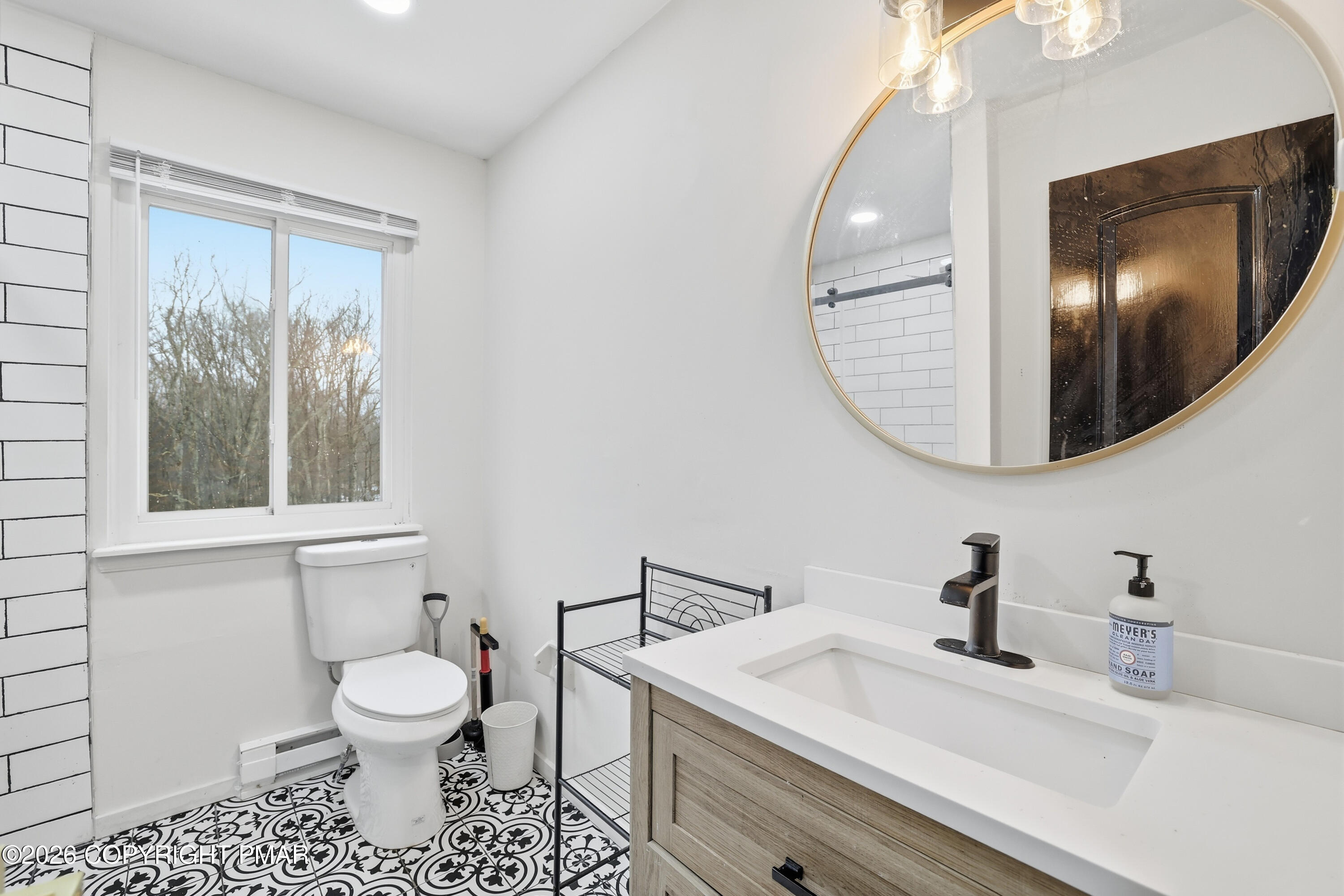 319 Ramble Bush Road Stroudsburg, PA 18360 - Photo 14 of 51 a bathroom with a sink and a mirror