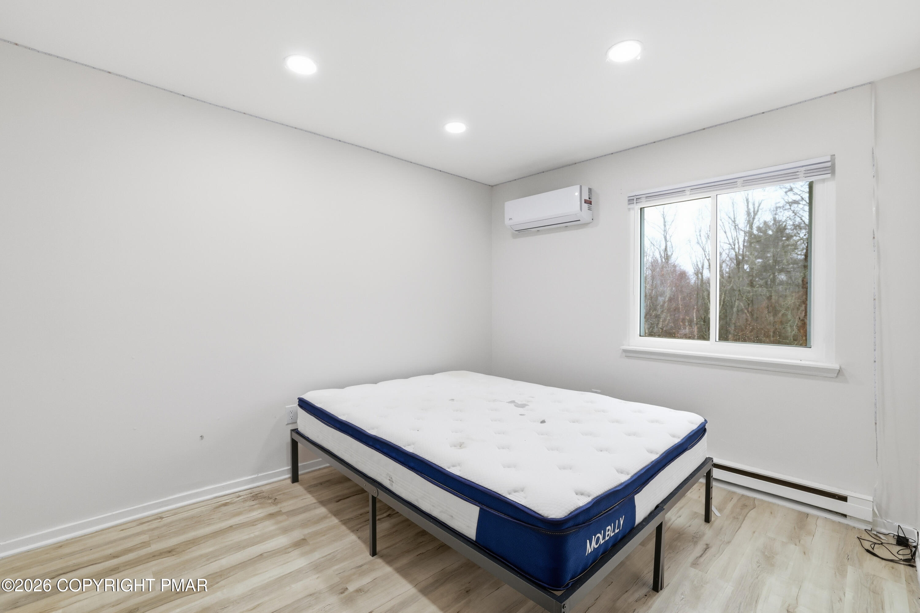 319 Ramble Bush Road Stroudsburg, PA 18360 - Photo 16 of 51 a room with a bed and a window