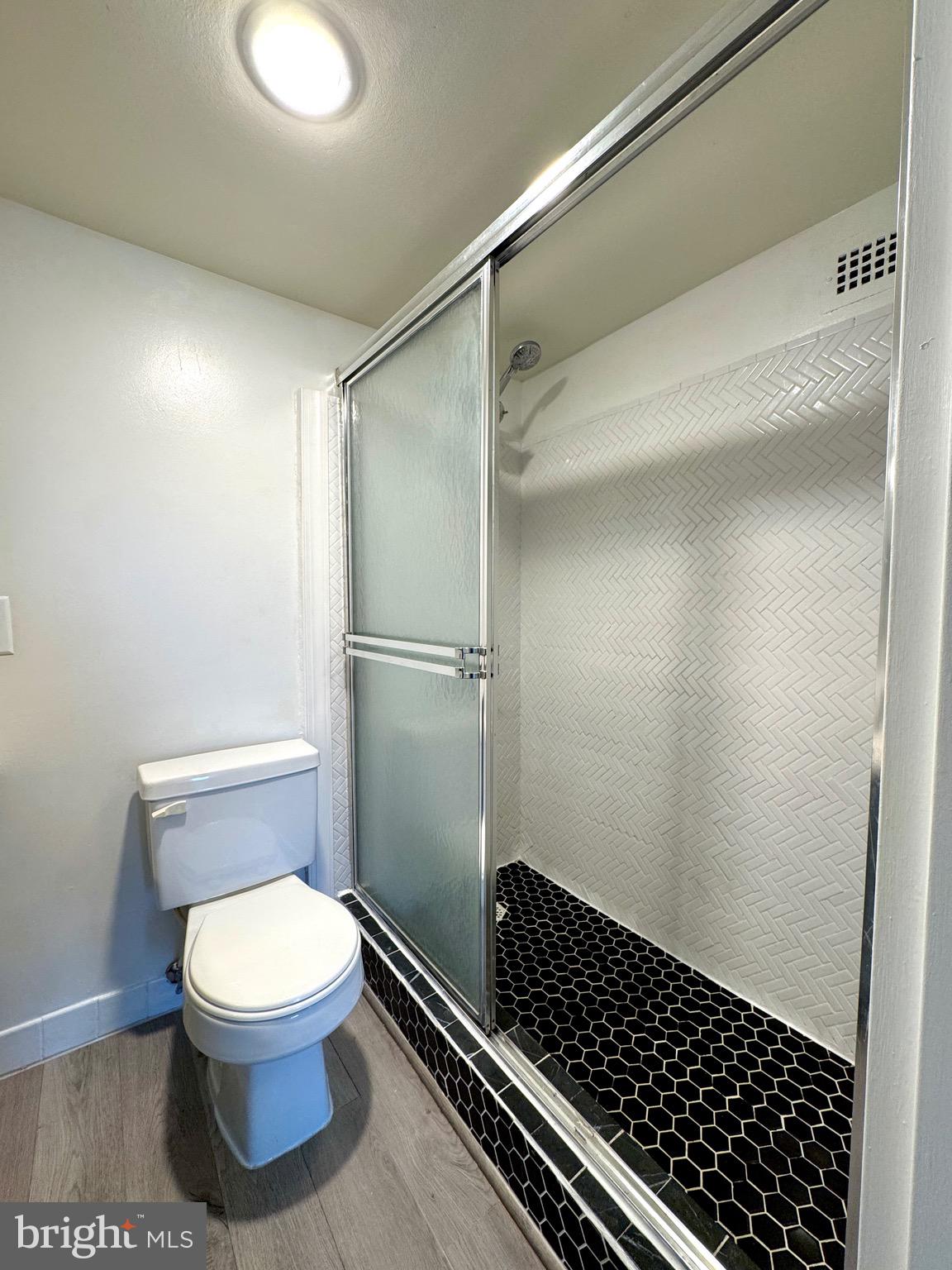 2300 Pimmit Drive, Unit 719 Falls Church, VA 22043 - Photo 12 of 15 a bathroom with a toilet and a shower