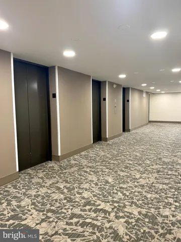 a view of a big room with closet and refrigerator