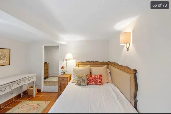 a bed room with a bed and a couch