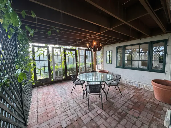 a outdoor dining space with furniture and outdoor view